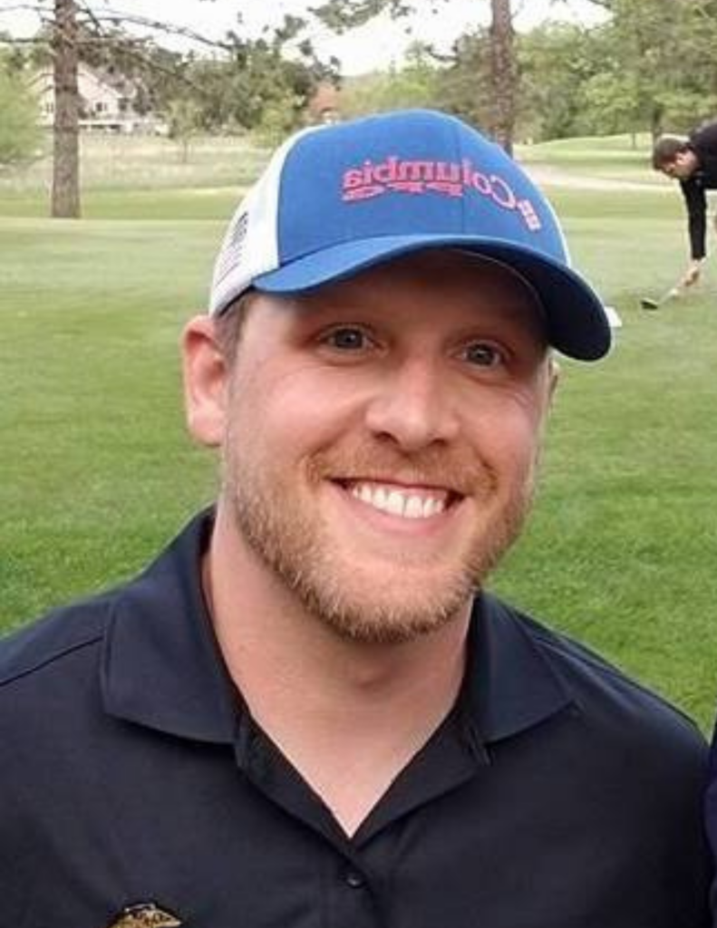 a man wearing a blue hat